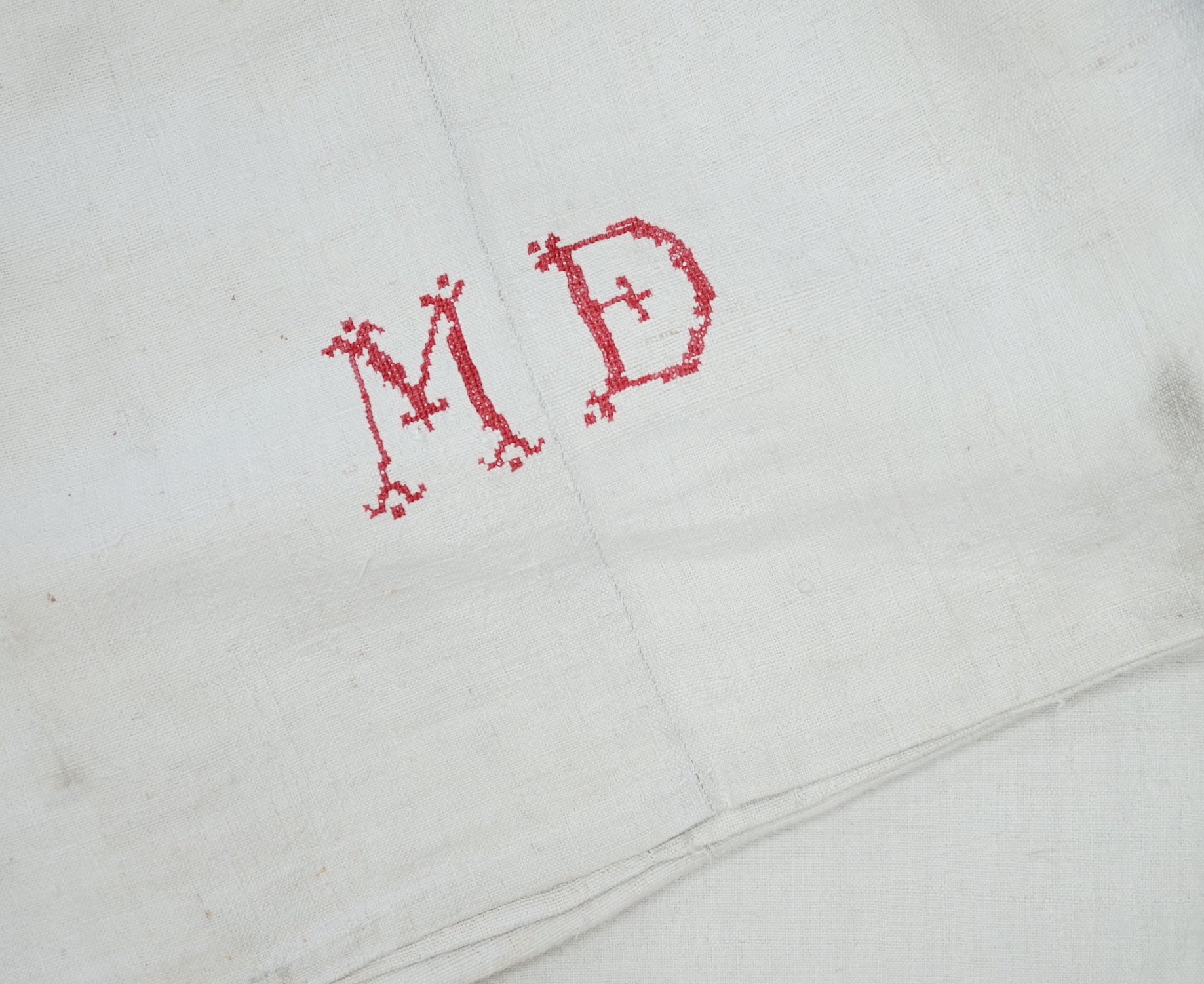 Ten 19th century French coarse provincial sheets, embroidered with initials MD